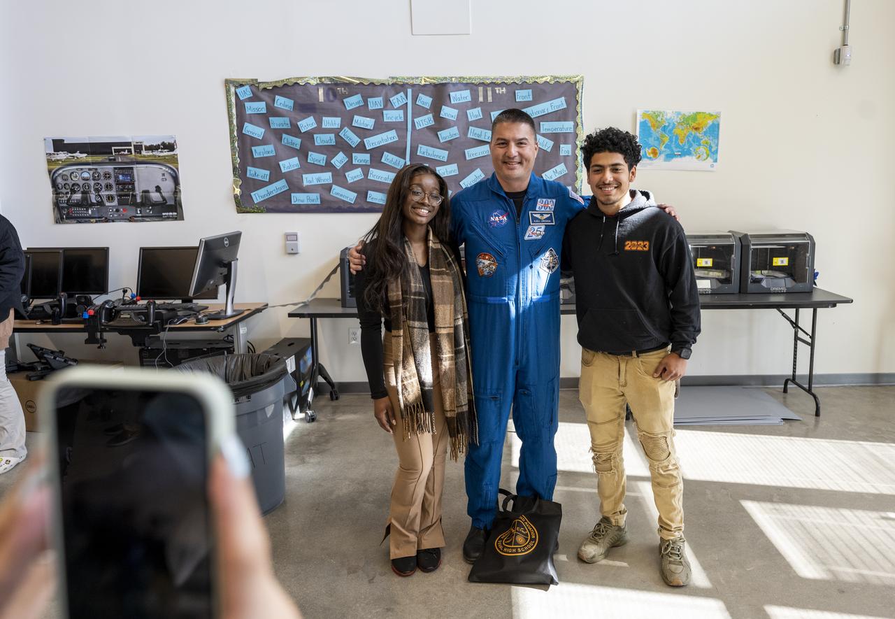 NASA astronaut Kjell Lindgren poses for photos with students following a STEM event at DuVal High School, Thursday, March 30, 2023, in Lanham, Maryland. Lindgren spent 170 days in space as part of Expeditions 67 and 68 aboard the International Space Station. Photo Credit: (NASA/Keegan Barber)
