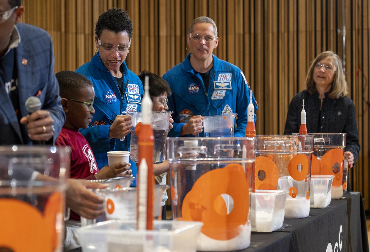NASA astronauts Jessica Watkins, left, and Robert Hines, right, participate in STEM demonstrations with local students at the Martin Luther King Jr Memorial Library, Thursday, March 30, 2023, in Washington. Lindgren, Hines, and Watkins spent 170 days in space as part of Expeditions 67 and 68 aboard the International Space Station.  Photo Credit: (NASA/Keegan Barber)