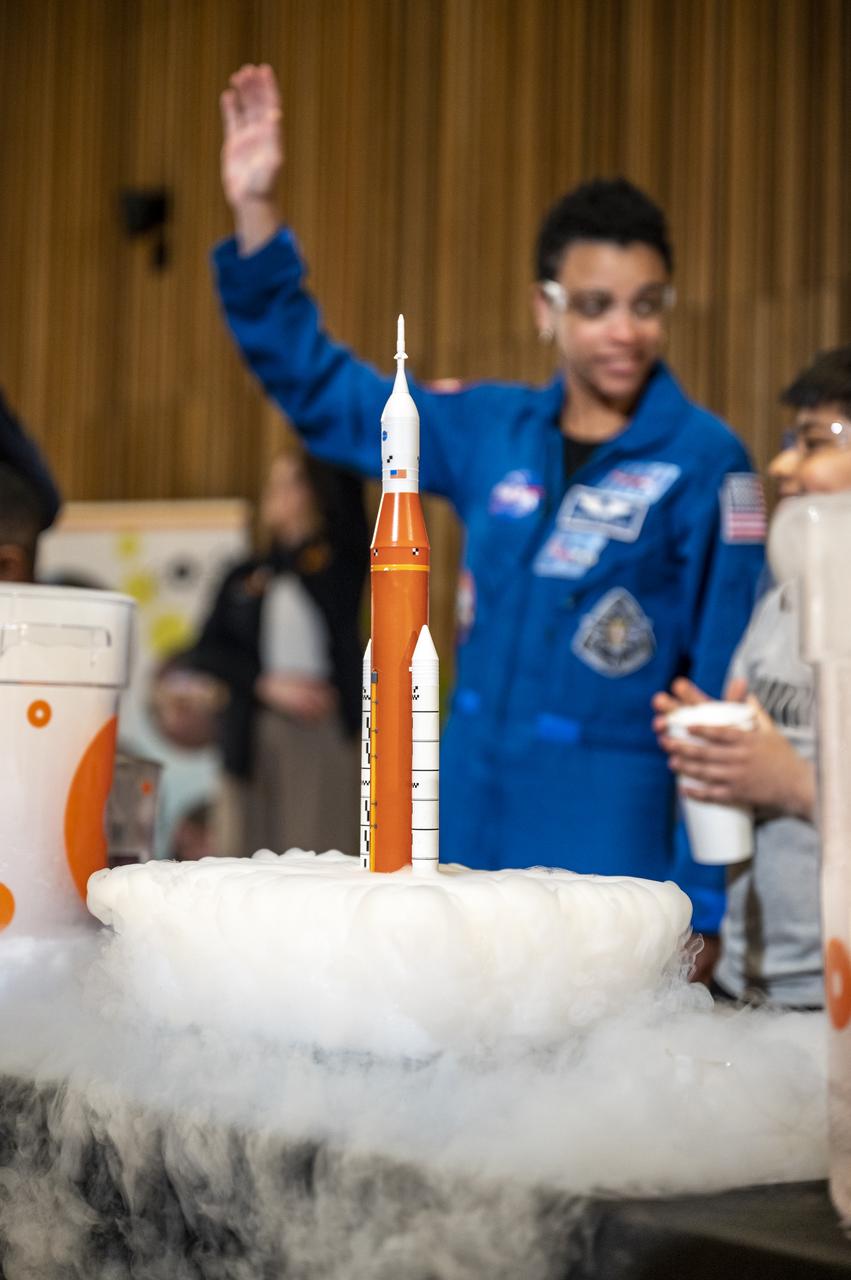 A scale model of NASA’s Space Launch System (SLS) is seen in the foreground during an event with NASA astronauts Jessica Watkins, Robert Hines, and Kjell Lindgren at the Martin Luther King Jr Memorial Library, Thursday, March 30, 2023, in Washington. Lindgren, Hines, and Watkins spent 170 days in space as part of Expeditions 67 and 68 aboard the International Space Station. Photo Credit: (NASA/Keegan Barber)