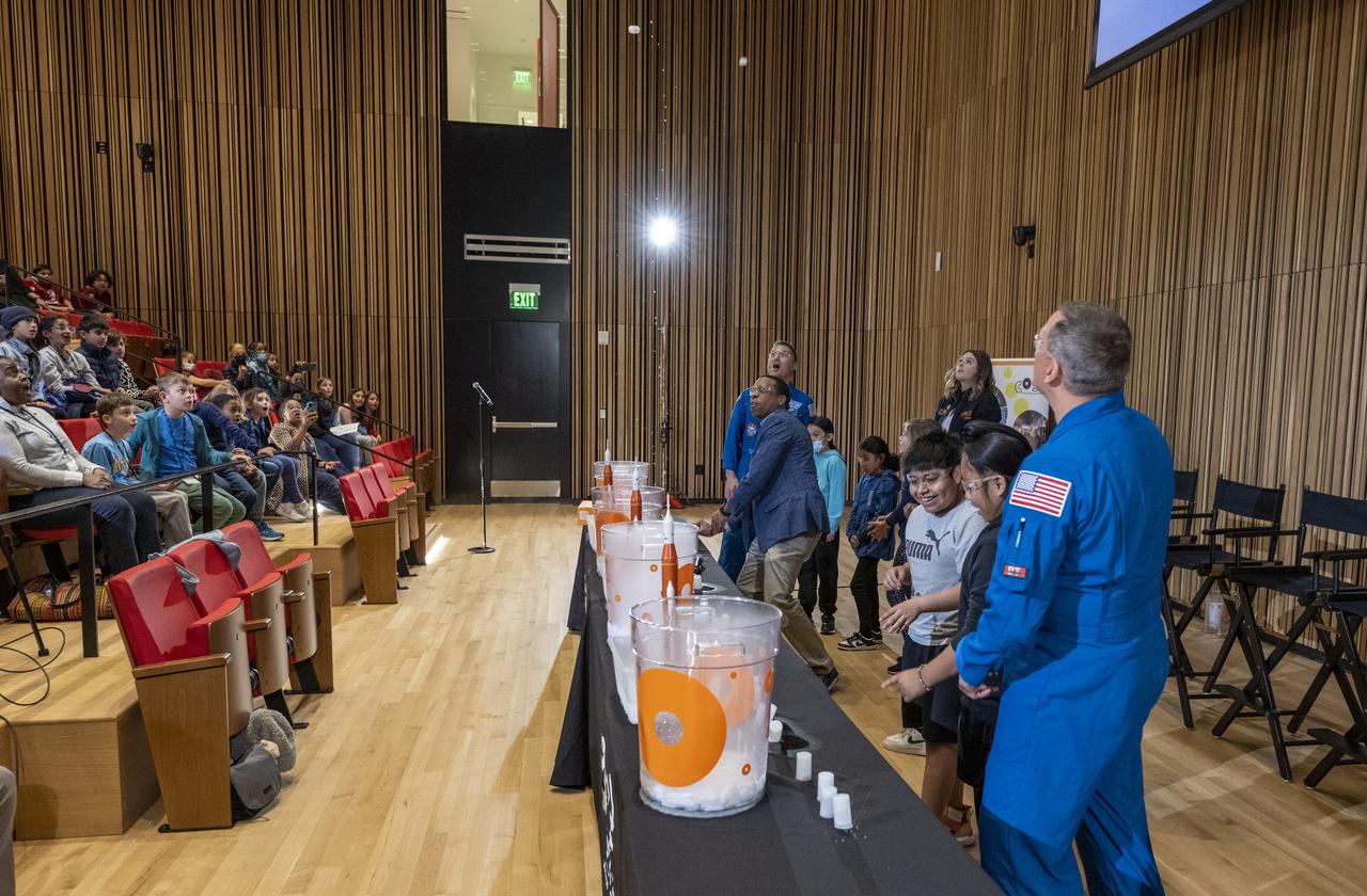 NASA astronauts Kjell Lindgren, Jessica Watkins, and Robert Hines participate in STEM demonstrations with local students at the Martin Luther King Jr Memorial Library, Thursday, March 30, 2023, in Washington. Lindgren, Hines, and Watkins spent 170 days in space as part of Expeditions 67 and 68 aboard the International Space Station.  Photo Credit: (NASA/Keegan Barber)