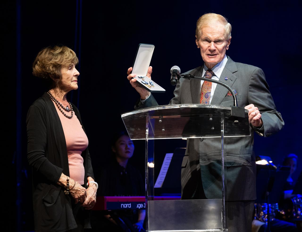 NASA Administrator Bill Nelson, right, presents Jeannie Schulz, widow of Peanuts gang creator Charles M. Schulz, with a NASA Exceptional Achievement Medal, Wednesday, April 5, 2023, at the “Our Blue Planet” concert at the John F. Kennedy Center for the Performing Arts in Washington. Snoopy rode along as the zero gravity indicator on NASA’s Artemis I mission as part of a partnership with the agency and continues to help NASA inspire kids of all ages to follow along with Artemis missions. Photo Credit: (NASA/Joel Kowsky)