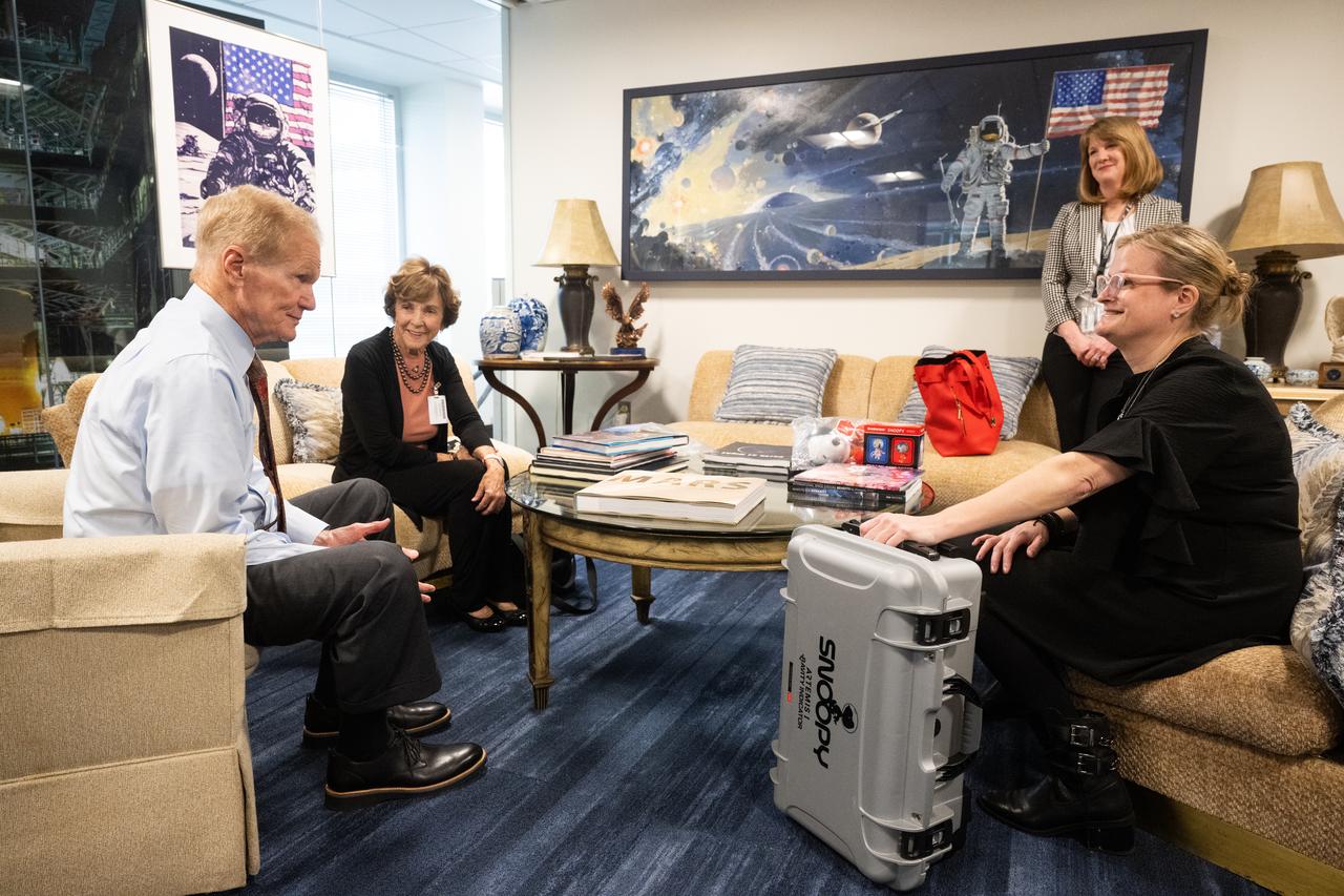 NASA Administrator Bill Nelson, left, Jeannie Schulz, widow of Peanuts gang creator Charles M. Schulz, second from left, Maureen O’Brien, manager of strategic alliances at NASA Headquarters, second from right, and Melissa Menta, executive vice president at Peanuts Worldwide, right, are seen Wednesday, April 5, 2023, at the Mary W. Jackson NASA Headquarters building in Washington.  Schulz was awarded a NASA Exceptional Achievement Medal by Administrator Nelson at an Our Blue Planet concert at the Kennedy Center for the Performing Arts. Snoopy rode along as the zero gravity indicator on NASA’s Artemis I mission as part of a partnership with the agency and continues to help NASA inspire kids of all ages to follow along with Artemis missions. As part of the visit, Schulz showed the flown Artemis I Snoopy zero gravity indicator before it goes to its final home for display at the Schulz Museum in Santa Rosa, California.  Photo Credit: (NASA/Joel Kowsky)