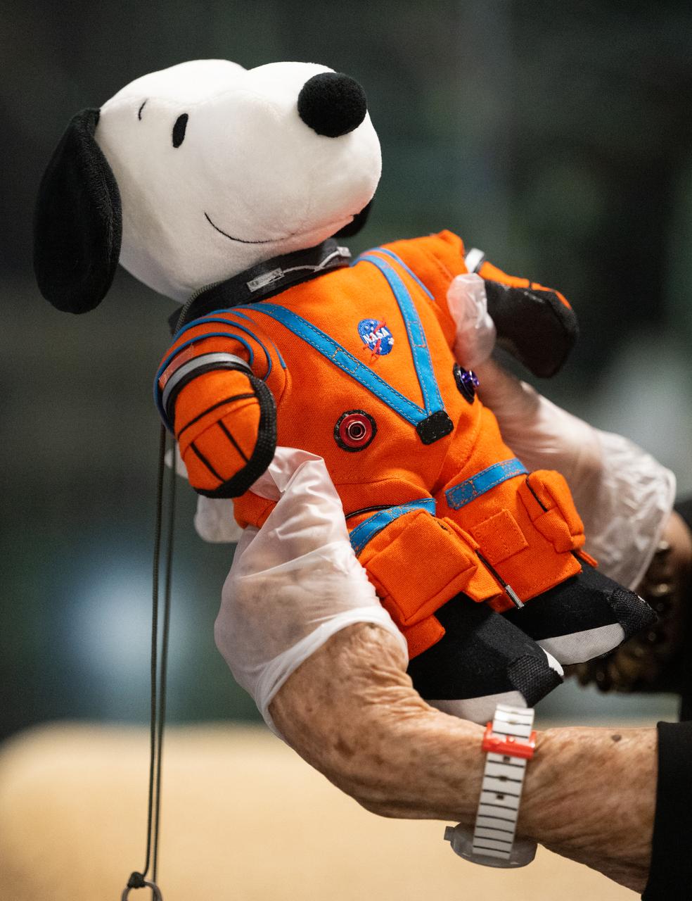 Jeannie Schulz, widow of Peanuts gang creator Charles M. Schulz, holds the Artemis I Snoopy zero gravity indicator, Wednesday, April 5, 2023, during visit to the Mary W. Jackson NASA Headquarters building in Washington. Schulz was awarded a NASA Exceptional Achievement Medal by Administrator Nelson at an Our Blue Planet concert at the Kennedy Center for the Performing Arts. Snoopy rode along as the zero gravity indicator on NASA’s Artemis I mission as part of a partnership with the agency and continues to help NASA inspire kids of all ages to follow along with Artemis missions. As part of the visit, Schulz showed the flown Artemis I Snoopy zero gravity indicator before it goes to its final home for display at the Schulz Museum in Santa Rosa, California.  Photo Credit: (NASA/Joel Kowsky)