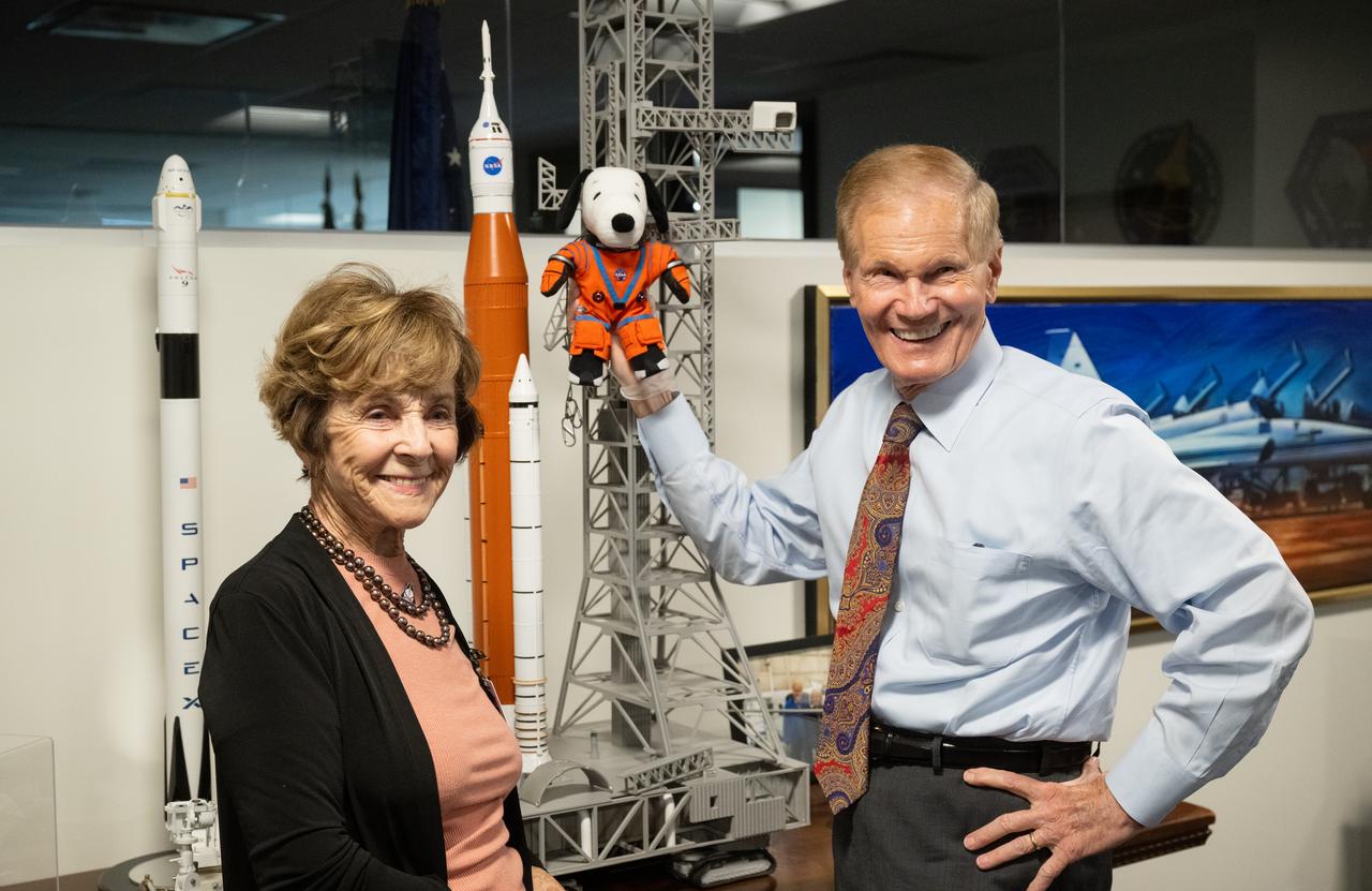 NASA Administrator Bill Nelson, right, holding the Artemis I Snoopy zero gravity indicator, is seen with Jeannie Schulz, widow of Peanuts gang creator Charles M. Schulz, left, Wednesday, April 5, 2023, during a visit to the Mary W. Jackson NASA Headquarters building in Washington. Schulz awarded a NASA Exceptional Achievement Medal by Administrator Nelson at an “Our Blue Planet” concert at the John F. Kennedy Center for the Performing Arts. Snoopy rode along as the zero gravity indicator on NASA’s Artemis I mission as part of a partnership with the agency and continues to help NASA inspire kids of all ages to follow along with Artemis missions. As part of the visit, Schulz showed the flown Artemis I Snoopy zero gravity indicator before it goes to its final home for display at the Schulz Museum in Santa Rosa, California.  Photo Credit: (NASA/Joel Kowsky)