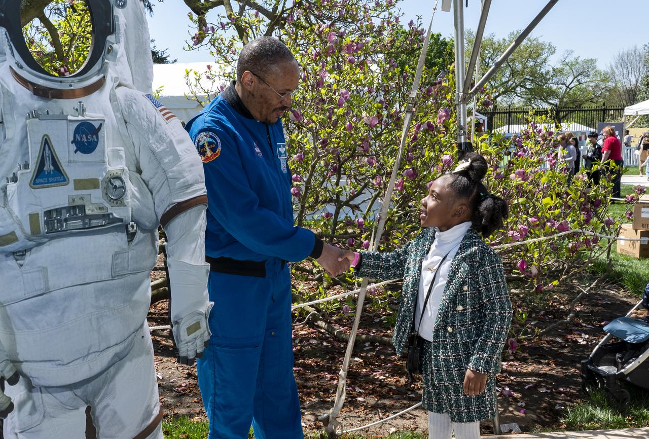 NASA astronaut Alvin Drew shakes a hands with a guest during the White House Easter Egg Roll, Monday, April 10, 2023, on the South Lawn of the White House in Washington. Photo Credit: (NASA/Keegan Barber)