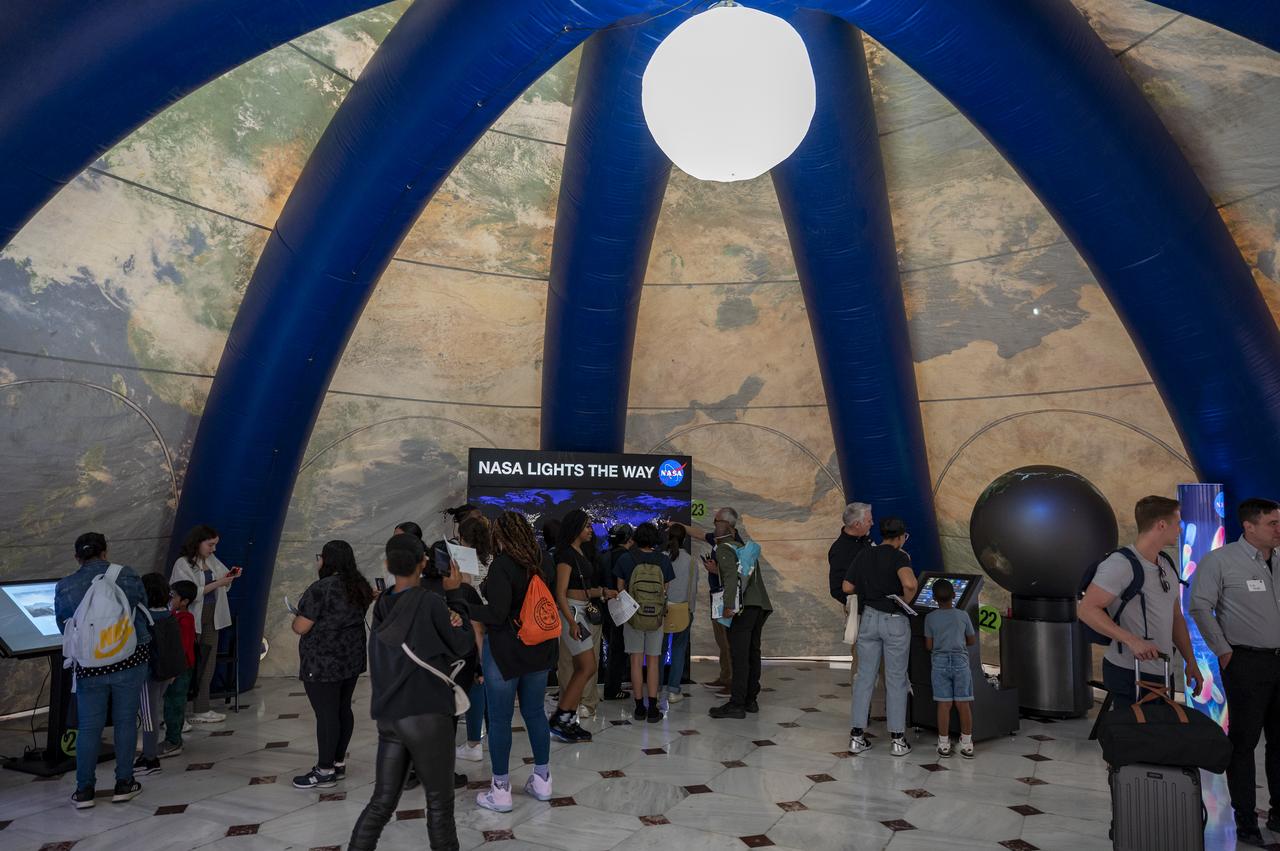 Visitors explore NASA’s hands-on exhibits during an Earth Day event, Thursday, April 20, 2023, at Union Station in Washington.  Photo Credit: (NASA/Keegan Barber)
