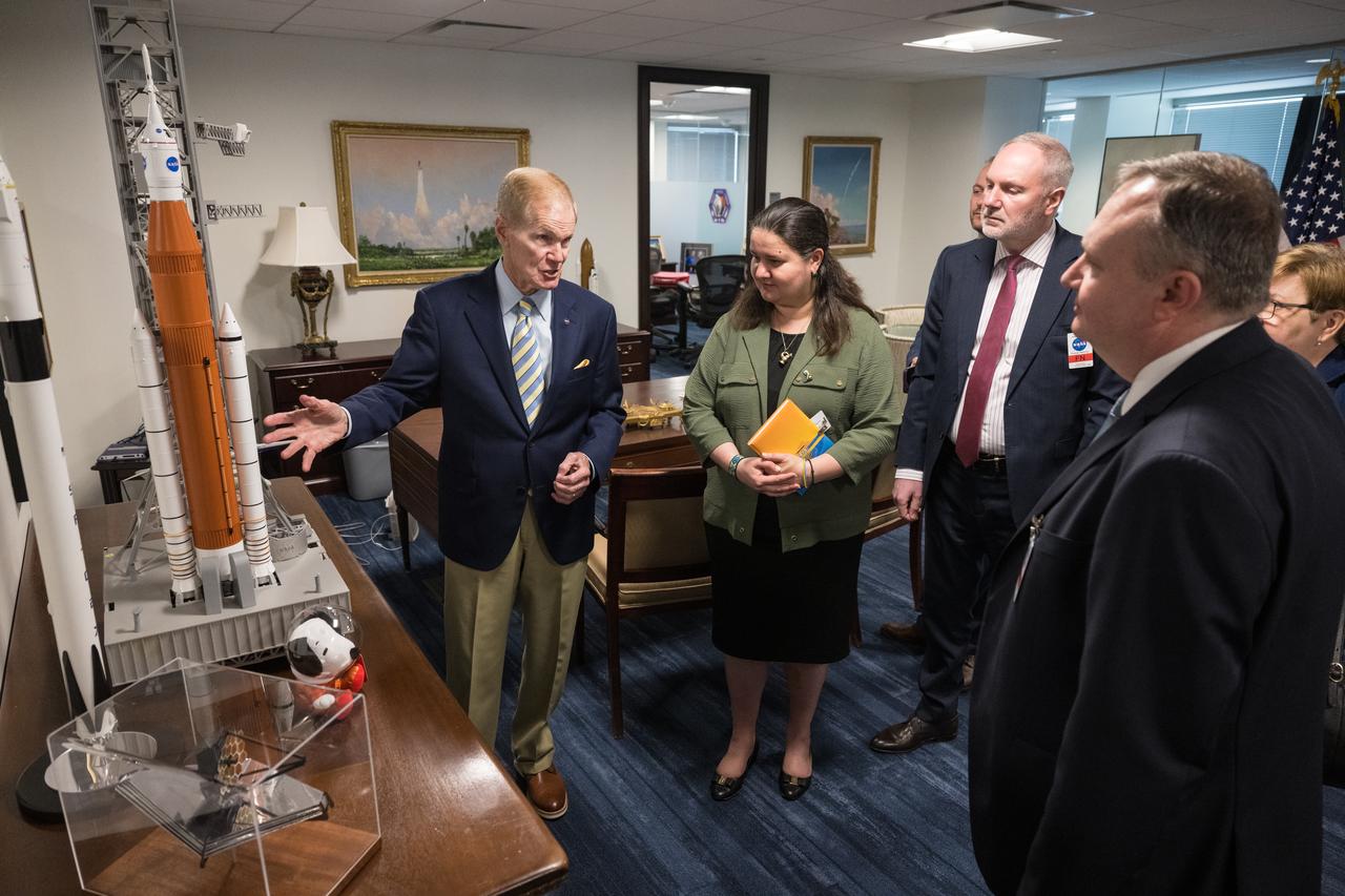 NASA Administrator Bill Nelson, left shows Ambassador of Ukraine, Her Excellency Oksana Markarova, second from left, Ukraine Deputy Minister of Economy, Ihor Fomenko, third from left, and Deputy Chairman of the State Space Agency of Ukraine, Volodymyr Mikheiev, right, a model of the Space Launch System (SLS) before signing a joint statement on civil space cooperation between NASA and the State Space Agency of Ukraine, Friday April 21, 2023 at the Mary W. Jackson NASA Headquarters building in Washington DC. Photo Credit: (NASA/Aubrey Gemignani)