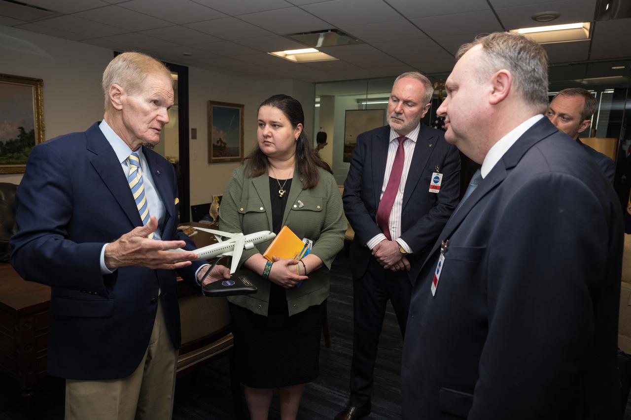NASA Administrator Bill Nelson, left shows Ambassador of Ukraine, Her Excellency Oksana Markarova, second from left, Ukraine Deputy Minister of Economy, Ihor Fomenko, third from left, Deputy Chairman of the State Space Agency of Ukraine, Volodymyr Mikheiev, right, and Embassy of Ukraine’s Chief of Staff, Denys Sienik, a model in his office before signing a joint statement on civil space cooperation between NASA and the State Space Agency of Ukraine, Friday April 21, 2023 at the Mary W. Jackson NASA Headquarters building in Washington DC. Photo Credit: (NASA/Aubrey Gemignani)