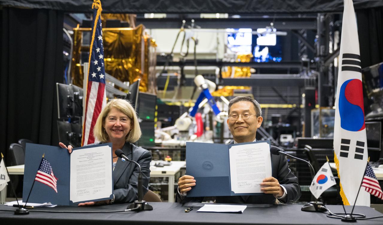 NASA Deputy Administrator Pam Melroy and MSIT Minister Jong-Ho Lee display the Joint Statement of Intent to advance cooperation in exploration and science between NASA and the Ministry of Science and ICT of the Republic of Korea after signing them, Tuesday, April 25, 2023, at NASA’s Goddard Space Flight Center in Greenbelt, Md.  Photo Credit: (NASA/Aubrey Gemignani)