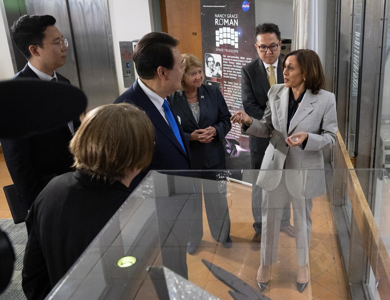 Vice President Kamala Harris, right, NASA Deputy Administrator Pam Melroy, and President Yoon Suk Yeol of the Republic of Korea are seen during a briefing by Dr. Julie McEnery, senior project scientist on NASA’s Nancy Grace Roman Space Telescope, on the Nancy Grace Roman Space Telescope in the observation area of the high bay clean room, Tuesday, April 25, 2023, at NASA’s Goddard Space Flight Center in Greenbelt, Md.  Photo Credit: (NASA/Joel Kowsky)