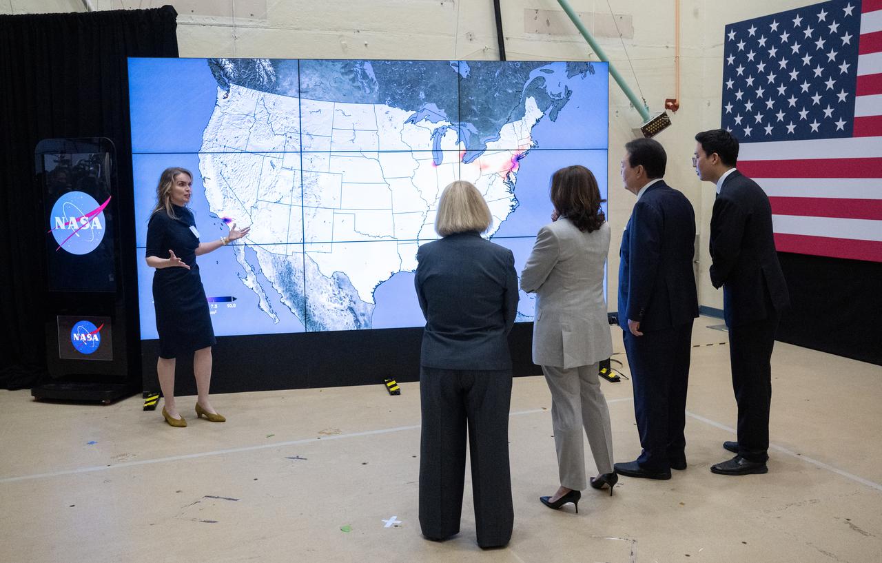Dr. Lesley Ott, research meteorologist and climate scientist at NASA’s Goddard Space Flight Center, left, briefs Vice President Kamala Harris, center, President Yoon Suk Yeol of the Republic of Korea, second from right, and NASA Deputy Administrator Pam Melroy, second from left, on U.S. and Korean partnerships to improve the way scientists observe air quality and the use of space in addressing the climate crisis, Tuesday, April 25, 2023, during a tour of NASA’s Goddard Space Flight Center in Greenbelt, Md.  Photo Credit: (NASA/Joel Kowsky)