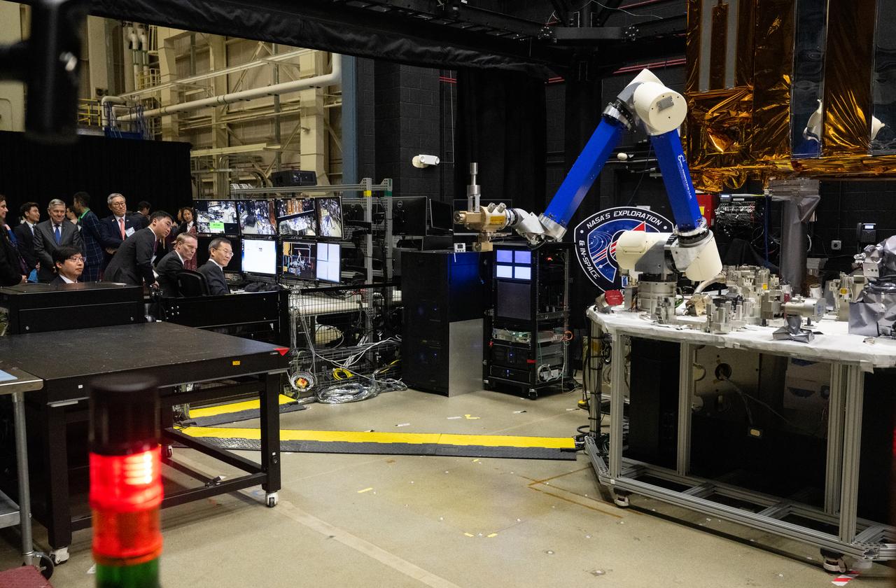 MSIT Minister Jong-Ho Lee uses a controller to manipulate one of the robotic arms at the Robot Operations Center (ROC), Tuesday, April 25, 2023, during a tour of NASA’s Goddard Space Flight Center in Greenbelt, Md. Photo Credit: (NASA/Joel Kowsky)