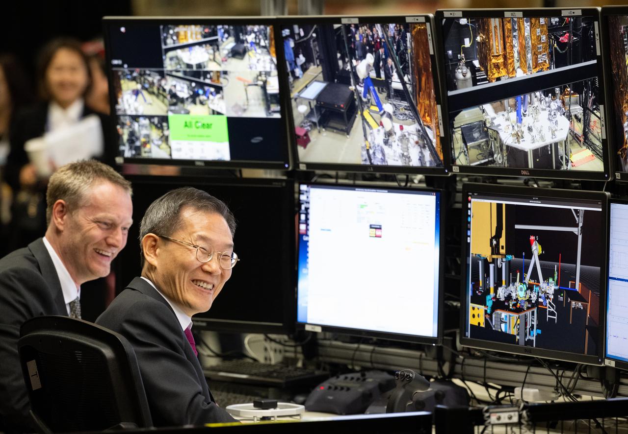 Joe Easley, robotics demonstration and test engineer at NASA’s Goddard Space Flight Center, left, is seen with MSIT Minister Jong-Ho Lee as he uses a controller to manipulate one of the robotic arms at the Robot Operations Center (ROC), Tuesday, April 25, 2023, during a tour of NASA’s Goddard Space Flight Center in Greenbelt, Md. Photo Credit: (NASA/Joel Kowsky)