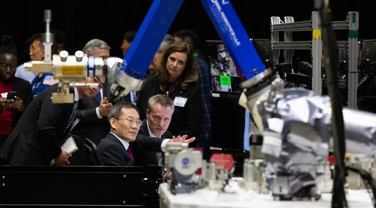 Joe Easley, robotics demonstration and test engineer at NASA’s Goddard Space Flight Center, right, is seen with MSIT Minister Jong-Ho Lee as he discusses one of the robotic arms at the Robot Operations Center (ROC), Tuesday, April 25, 2023, during a tour of NASA’s Goddard Space Flight Center in Greenbelt, Md. Photo Credit: (NASA/Joel Kowsky)