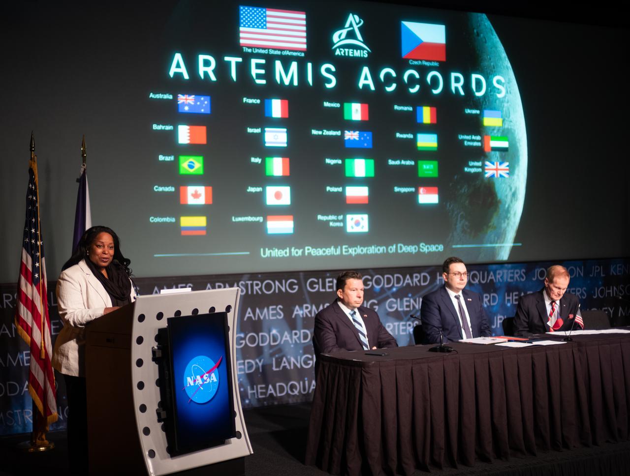 Acting Assistant Secretary of State for Oceans and International Environmental and Scientific Affairs Jennifer R. Littlejohn, delivers remarks prior to the signing of the Artemis Accords as Miloslav Stašek, Ambassador of the Czech Republic to the United States, second from left, Foreign Affairs Minister for the Czech Republic, Jan Lipavský, second from right, and NASA Administrator Bill Nelson, right, look on, Wednesday, May 3, 2023, at The Mary W. Jackson NASA Headquarters building in Washington DC. The Czech Republic is the twenty fourth country to sign the Artemis Accords, which establish a practical set of principles to guide space exploration cooperation among nations participating in NASA’s Artemis program. Photo Credit: (NASA/Joel Kowsky)