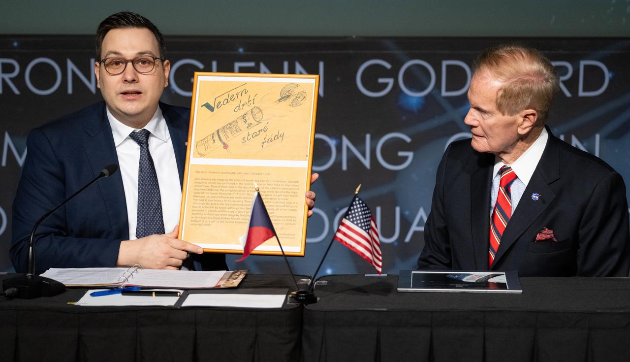 Foreign Affairs Minister for the Czech Republic Jan Lipavský, left, presents NASA Administrator Bill Nelson with a reproduction of an original drawing made by a Czechoslovak boy named Petr Ginz of partial Jewish background who was murdered at Auschwitz concentration camp in 1944, despite being of very young age, he had authored novels and made his own illustrations including this one depicting planet Earth seen from the moon, following the signing of the Artemis Accords, Wednesday, May 3, 2023, at The Mary W. Jackson NASA Headquarters building in Washington DC. The Czech Republic is the twenty fourth country to sign the Artemis Accords, which establish a practical set of principles to guide space exploration cooperation among nations participating in NASA’s Artemis program. Photo Credit: (NASA/Joel Kowsky)