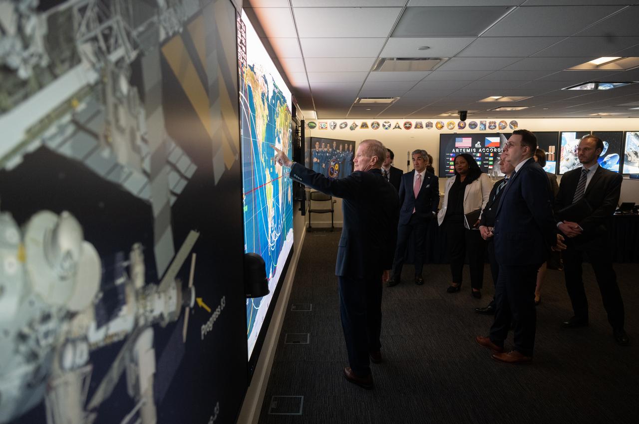 NASA Administrator Bill Nelson, left, points to a ground track map for the International Space Station in the Space Operations Center during a tour with Miloslav Stašek, Ambassador of the Czech Republic to the United States, Foreign Affairs Minister for the Czech Republic, Jan Lipavský, and Acting Assistant Secretary of State for Oceans and International Environmental and Scientific Affairs Jennifer R. Littlejohn, following the signing of the Artemis Accords, Wednesday, May 3, 2023, at The Mary W. Jackson NASA Headquarters building in Washington DC. The Czech Republic is the twenty fourth country to sign the Artemis Accords, which establish a practical set of principles to guide space exploration cooperation among nations participating in NASA’s Artemis program. Photo Credit: (NASA/Joel Kowsky)