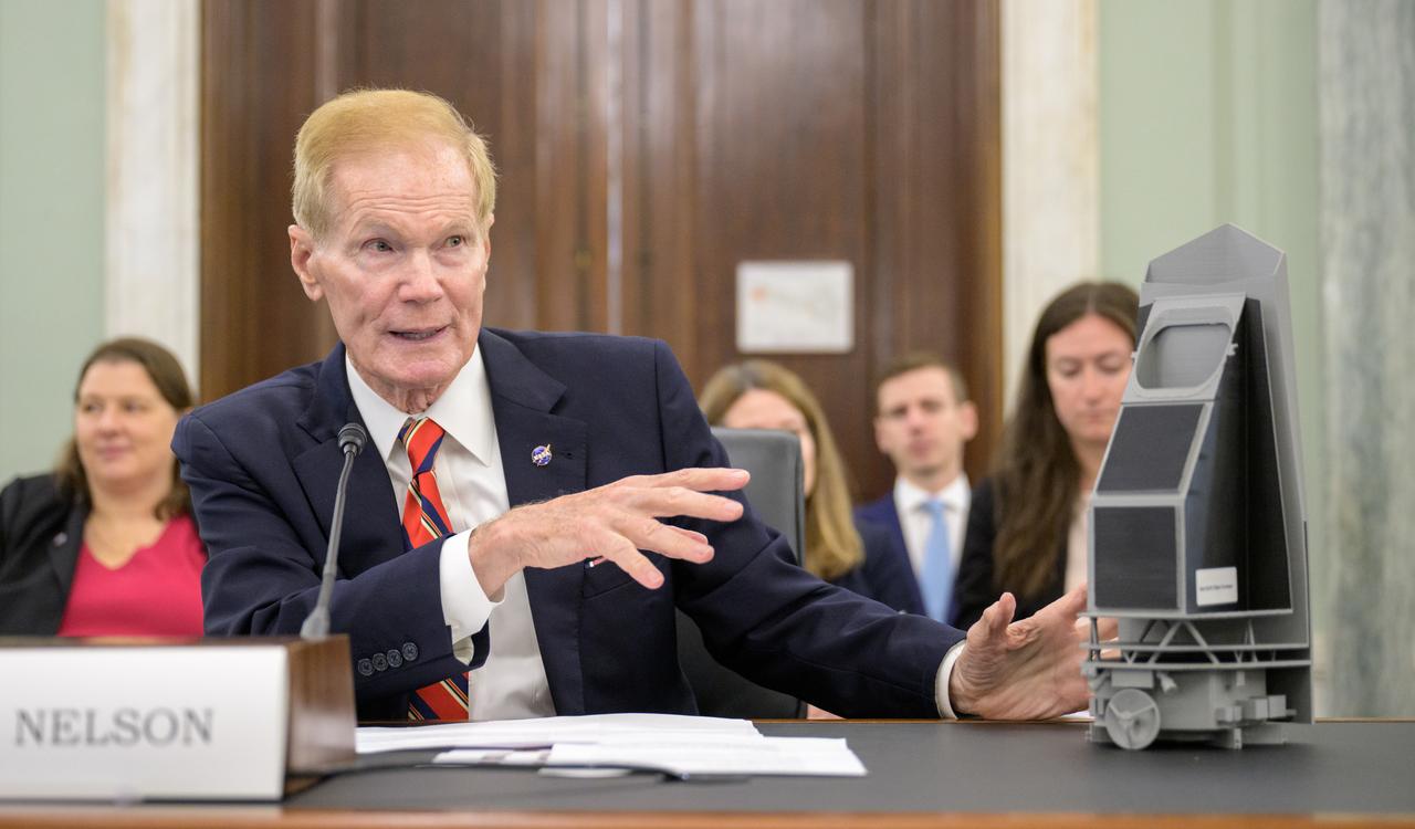 NASA Administrator Bill Nelson points to a model of the Near-Earth Object Surveyor space telescope (NEO Surveyor) as he testifies before the Senate Committee on Commerce, Science, and Transportation during a hearing titled “Examining NASA’s Budget and Priorities,” Tuesday, May 16, 2023, at the Russell Senate Office Building in Washington. Photo Credit: (NASA/Bill Ingalls)