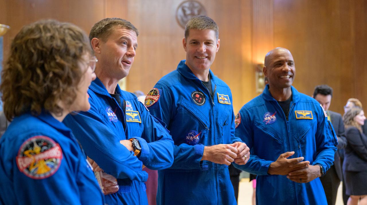 NASA astronauts Christina Hammock Koch, left, Reid Wiseman, CSA (Canadian Space Agency) astronaut Jeremy Hansen, and NASA astronaut Victor Glover, right, talk during a meet and greet, Wednesday, May 17, 2023, at the Dirksen Senate Office Building in Washington. Wiseman, Glover, Hammock Koch, and Hansen, who will fly around the Moon on NASA’s Artemis II flight test, visited Washington to discuss their upcoming mission with members of Congress and others. Photo Credit: (NASA/Bill Ingalls)