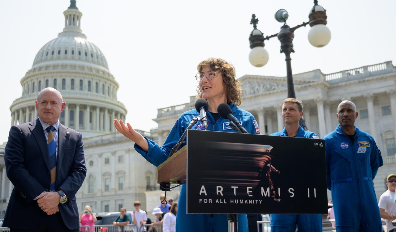 NASA astronaut Christina Hammock Koch gives remarks during a media gather as Sen. Mark Kelly, D-Ariz., left, and NASA astronauts Reid Wiseman and Victor Glover look on, Thursday, May 18, 2023, on Capitol Hill grounds in Washington. NASA astronauts Reid Wiseman, Victor Glover, Christina Hammock Koch, and CSA (Canadian Space Agency) astronaut Jeremy Hansen who will fly around the Moon on NASA’s Artemis II flight test visited Washington to discuss their upcoming mission with members of Congress and others. Photo Credit: (NASA/Bill Ingalls)