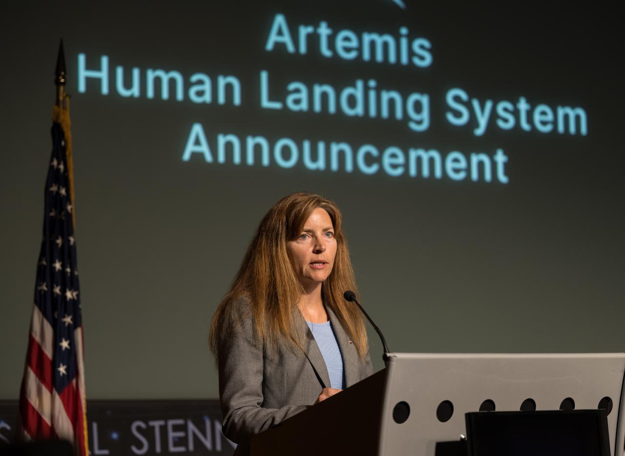 Human Landing System Program Manager Lisa Watson-Morgan gives remarks during an event announcing Blue Origin as the company selected to develop a sustainable human landing system for the Artemis V Moon mission, Friday, May 19, 2023 at the Mary W. Jackson NASA Headquarters building in Washington. The human landing system will take astronauts to and from Gateway in lunar orbit to the surface and back to the lunar space station as part of NASA’s return to the Moon for science, exploration, and inspiration. Photo Credit: (NASA/Aubrey Gemignani)