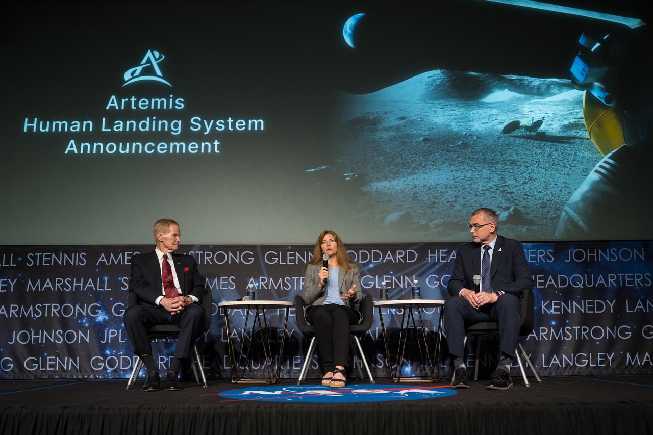 Human Landing System Program Manager Lisa Watson-Morgan gives remarks as NASA Administrator Bill Nelson, left, and NASA Associate Administrator for the Exploration Systems Development Mission Directorate Jim Free, right, look on during an event announcing Blue Origin as the company selected to develop a sustainable human landing system for the Artemis V Moon mission, Friday, May 19, 2023 at the Mary W. Jackson NASA Headquarters building in Washington. The human landing system will take astronauts to and from Gateway in lunar orbit to the surface and back to the lunar space station as part of NASA’s return to the Moon for science, exploration, and inspiration. Photo Credit: (NASA/Aubrey Gemignani)