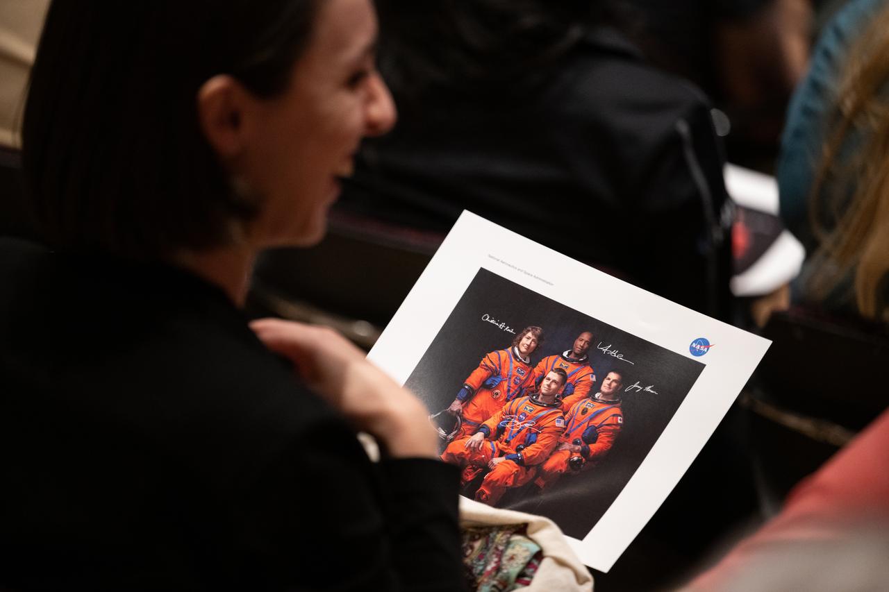 An employee of NASA’s Goddard Space Flight Center holds a photograph of NASA’s Artemis II crew, Friday, May 19, 2023, during an employee engagement event at NASA’s Goddard Space Flight Center in Greenbelt, Md. NASA astronauts Reid Wiseman, Victor Glover, Christina Hammock Koch, and CSA (Canadian Space Agency) astronaut Jeremy Hansen, who will fly around the Moon on NASA’s Artemis II flight test, visited Washington to discuss their upcoming mission with members of Congress and others. Photo Credit: (NASA/Joel Kowsky)