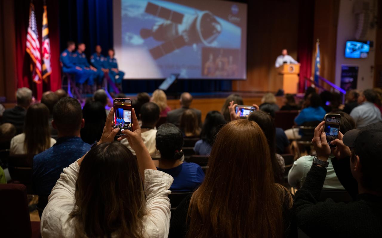 Members of the audience take pictures and videos as CSA (Canadian Space Agency) astronaut Jeremy Hansen, and NASA astronauts Reid Wiseman, Victor Glover, and Christina Hammock Koch, answer questions during an employee engagement event Friday, May 19, 2023, at NASA’s Goddard Space Flight Center in Greenbelt, Md. Wiseman, Glover, Hammock Koch, and Hansen, who will fly around the Moon on NASA’s Artemis II flight test, visited Washington to discuss their upcoming mission with members of Congress and others. Photo Credit: (NASA/Joel Kowsky)