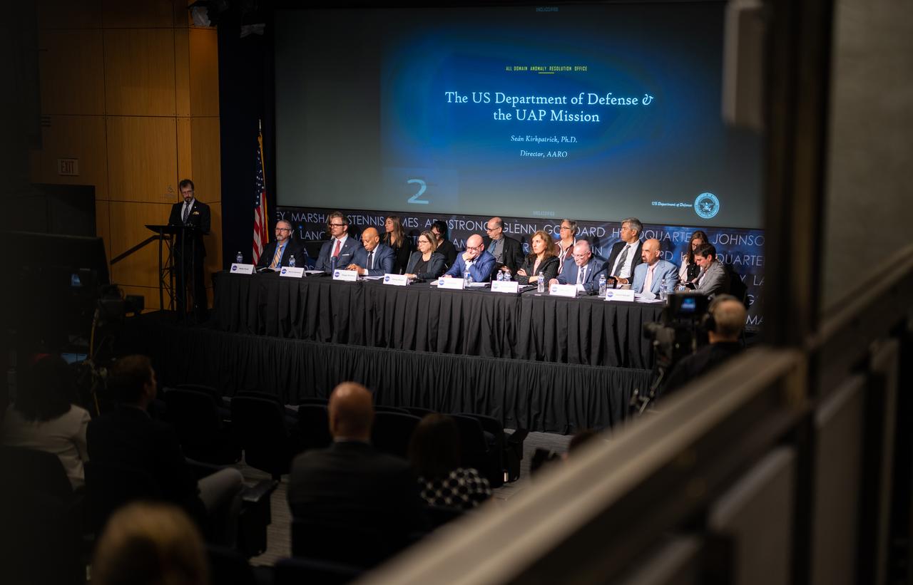 Dr. Sean Kirkpatrick, director of All-domain Anomaly Resolution Office at the Department of Defense, left, gives a presentation during a public meeting of NASA’s unidentified anomalous phenomena (UAP) independent study team, Wednesday, May 31, 2023 at the Mary W. Jackson NASA Headquarters building in Washington. The UAP independent study team is a counsel of 16 community experts across diverse areas on matters relevant to potential methods of study for unidentified anomalous phenomena. NASA commissioned the nine-month study to examine UAP from a scientific perspective and create a roadmap for how to use data and the tools of science to move our understanding of UAP forward. Photo Credit: (NASA/Joel Kowsky)