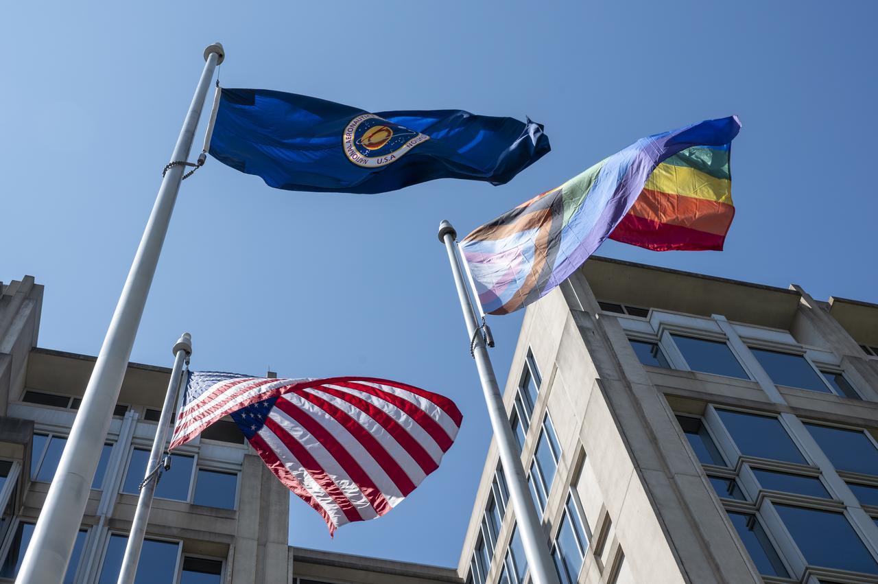 The Pride Progress Flag is seen waving in the wind following a flag raising ceremony in recognition and celebration of LGBTQI+ Pride Month, Thursday, June 1, 2023, at the Mary W. Jackson NASA Headquarters building in Washington. Photo Credit: (NASA/Keegan Barber)