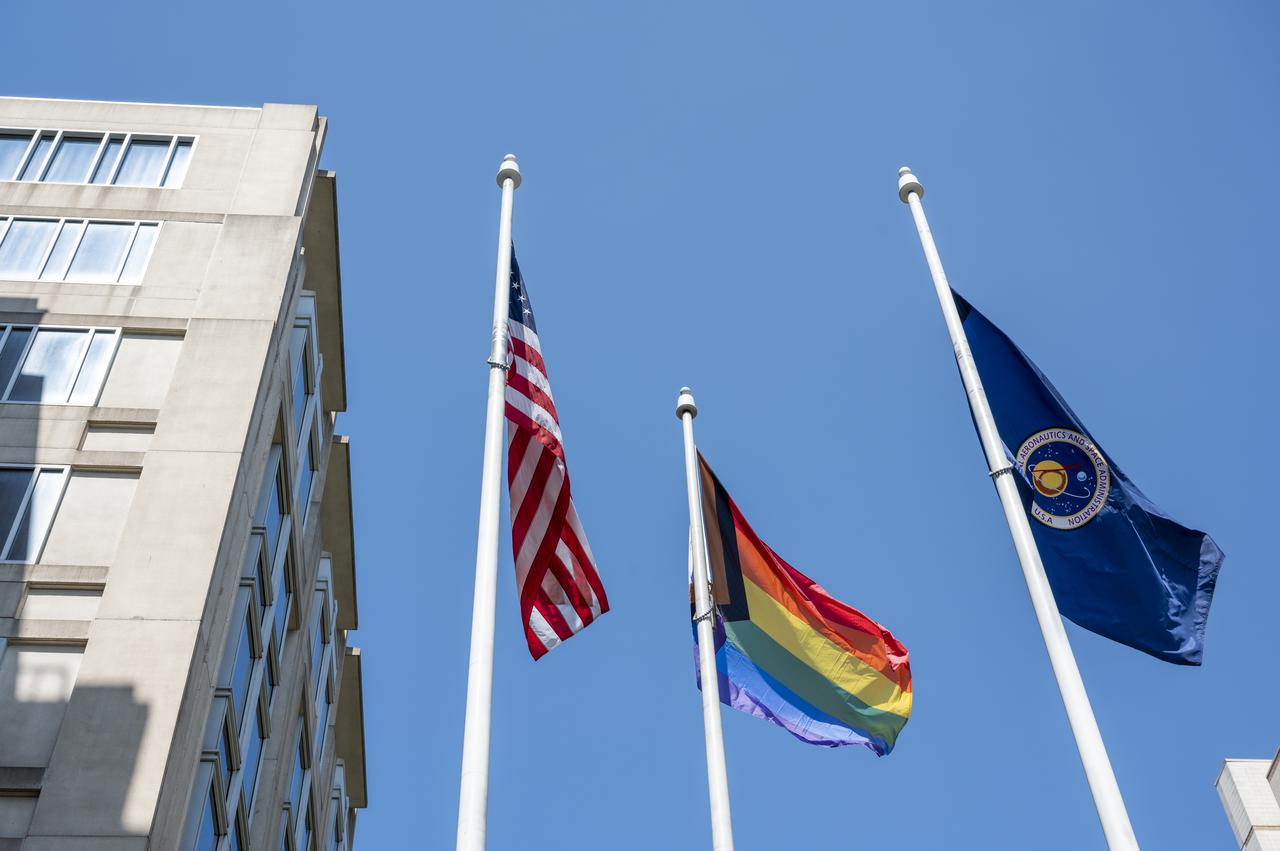 The Pride Progress Flag is seen waving in the wind following a flag raising ceremony in recognition and celebration of LGBTQI+ Pride Month, Thursday, June 1, 2023, at the Mary W. Jackson NASA Headquarters building in Washington. Photo Credit: (NASA/Keegan Barber)