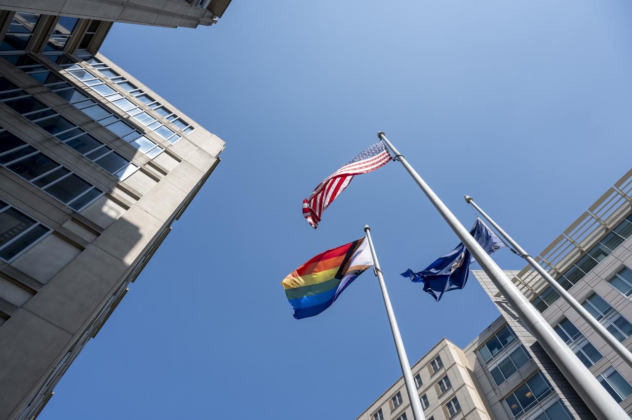 The Pride Progress Flag is seen waving in the wind following a flag raising ceremony in recognition and celebration of LGBTQI+ Pride Month, Thursday, June 1, 2023, at the Mary W. Jackson NASA Headquarters building in Washington. Photo Credit: (NASA/Keegan Barber)