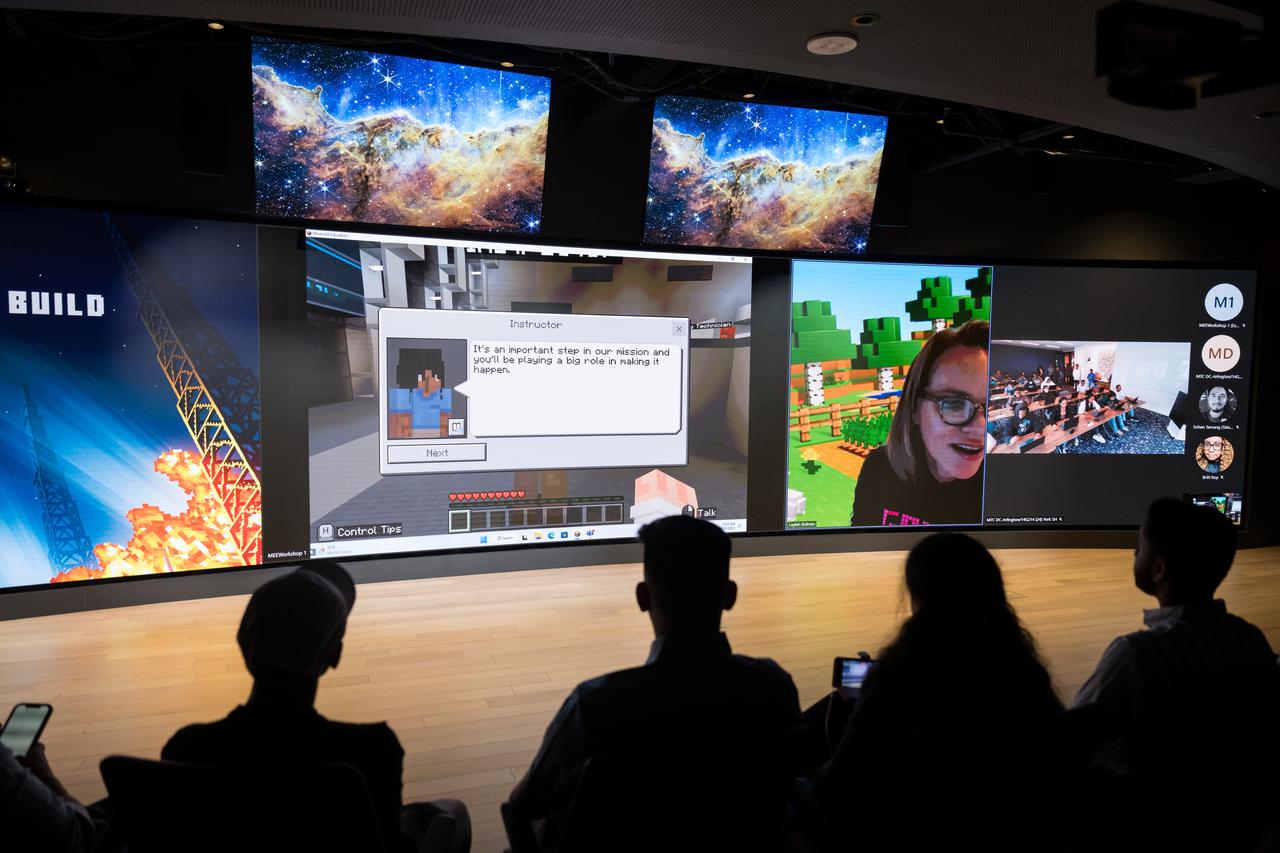 Microsoft Senior Program Manager and Executive Game Producer for Minecraft Education, Laylah Busman, provides instruction to DC area students during Space Education Day, Tuesday, June 20, 2023, at the Microsoft Technology Center in Arlington, Va. Microsoft hosted the event to showcase the collaboration, early successes, and future plans for high quality student engagement through activities that combined space content and technologies like artificial intelligence and cloud computing. Photo Credit: (NASA/Aubrey Gemignani)