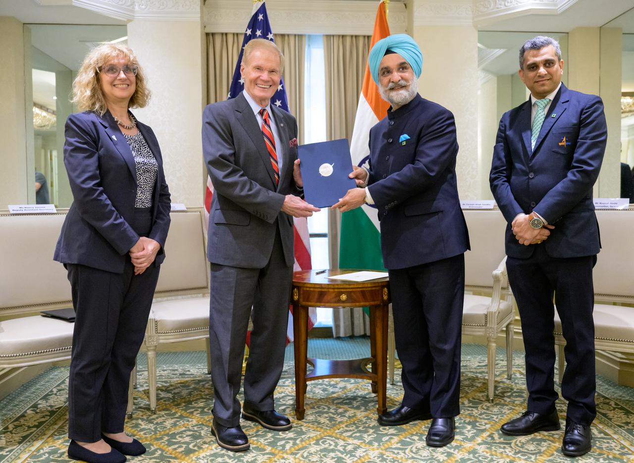 NASA Administrator Bill Nelson, 2nd from left, and Indian Ambassador Taranjit Sandhu, 3rd from left, hold the signed Artemis Accords, as U.S. Department of State, Deputy Assistant Secretary for India, Nancy Jackson, left, and Indian Space Research Organization, Space Counsellor, Krunal Joshi, right, join for the group photograph, Wednesday, June 21, 2023, at the Willard InterContinental Hotel in Washington. India is the 27th country to sign the Artemis Accords, which establish a practical set of principles to guide space exploration cooperation among nations participating in NASA’s Artemis program.  Photo Credit: (NASA/Bill Ingalls)