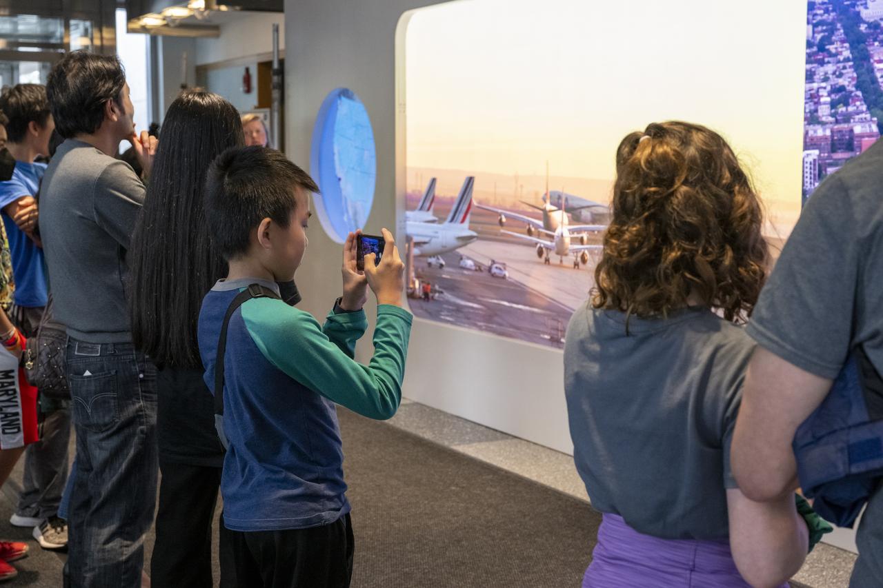 Local students participate in an Earth Information Center (EIC) student engagement event, Friday, June 23, 2023, at the Mary W. Jackson NASA Headquarters building in Washington. The EIC is a new immersive experience that combines live data sets with cutting-edge data visualization and storytelling to allow visitors to see how our planet is changing. Photo Credit: (NASA/Keegan Barber)