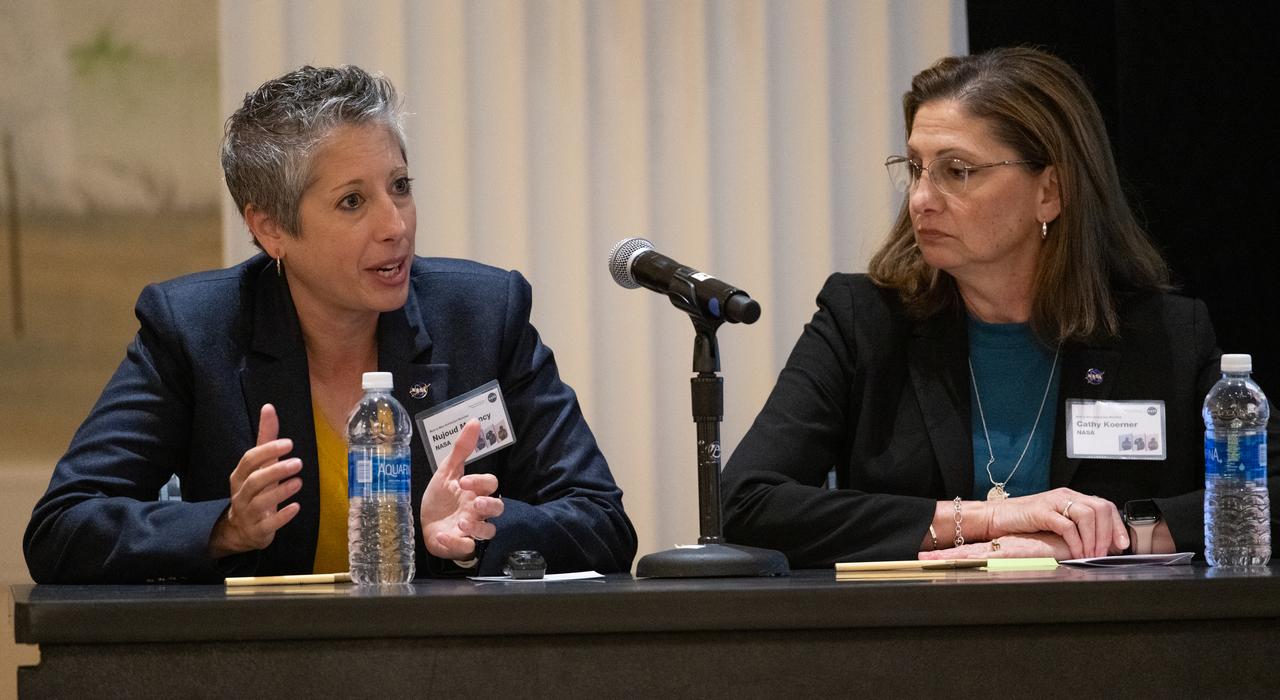 Nujoud Merancy, architecture lead for NASA's Exploration Systems Development Mission Directorate, left, and Catherine Koerner, deputy associate administrator for NASA's Exploration Systems Development Mission Directorate, are seen during NASA’s Moon to Mars Architecture Workshop, Tuesday, June 27, 2023, at the Gaylord National Resort and Convention Center in National Harbor, Md. Following the release of the 2022 Architecture Concept Review, NASA is conducting the workshop to engage the broader space community and collect feedback from U.S. industry and academia to inform the Moon to Mars mission architecture and operational delivery. Photo Credit: (NASA/Joel Kowsky)