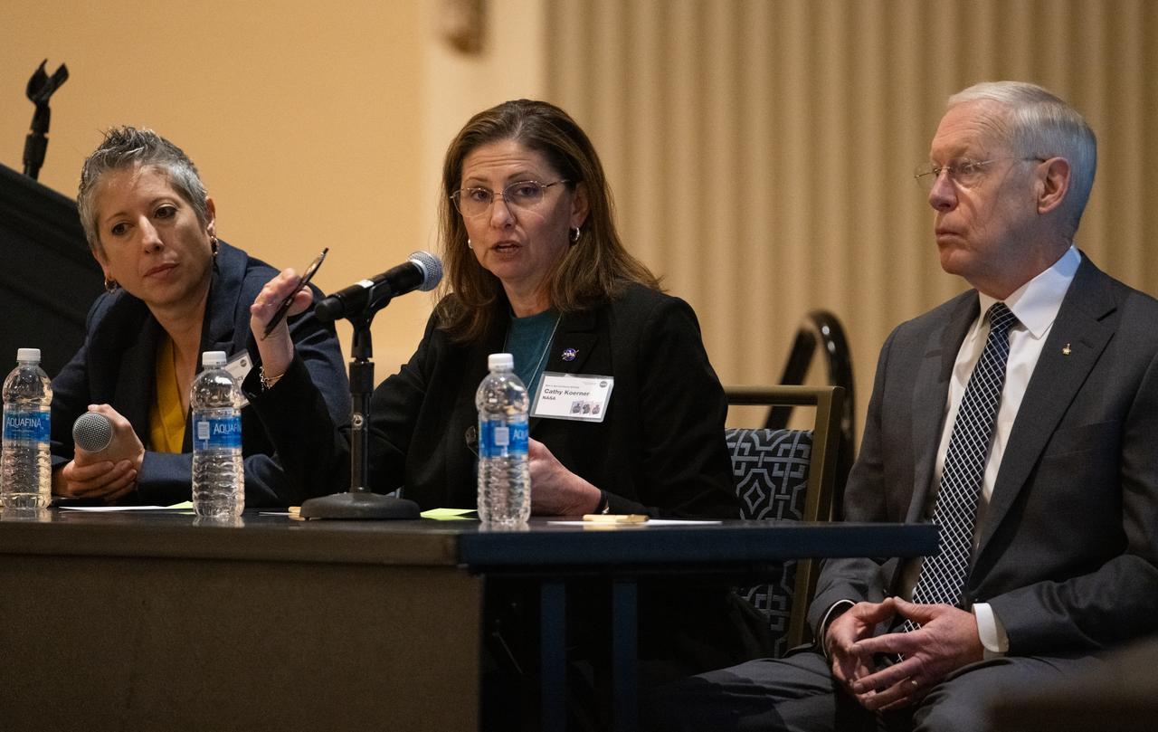 Catherine Koerner, deputy associate administrator for NASA's Exploration Systems Development Mission Directorate, center, is seen alongside Nujoud Merancy, architecture lead for NASA's Exploration Systems Development Mission Directorate, left, and Patrick Forrester, special advisor in NASA's Space Operations Mission Directorate, right, during NASA’s Moon to Mars Architecture Workshop, Tuesday, June 27, 2023, at the Gaylord National Resort and Convention Center in National Harbor, Md. Following the release of the 2022 Architecture Concept Review, NASA is conducting the workshop to engage the broader space community and collect feedback from U.S. industry and academia to inform the Moon to Mars mission architecture and operational delivery. Photo Credit: (NASA/Joel Kowsky)