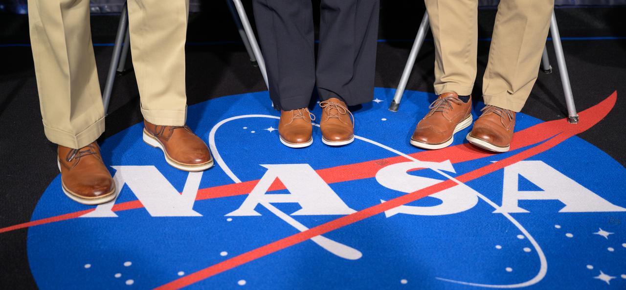 NASA Administrator Bill Nelson, left, NASA Deputy Administrator Pam Melroy, and NASA Associate Administrator Bob Cabana, right, pose for a photograph showing how they ended up wearing smilier shoes for a NASA town hall event, Wednesday, July 19, 2023, at the NASA Headquarters Mary W. Jackson Building in Washington. Photo Credit: (NASA/Bill Ingalls)