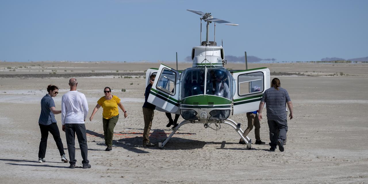 Recovery teams participate in helicopter training in preparation for the retrieval of the sample return capsule from NASA's OSIRIS-REx mission, Wednesday, July 19, 2023, at the Department of Defense's Utah Test and Training Range. The sample was collected from the asteroid Bennu in October 2020 by NASA’s OSIRIS-REx spacecraft and will return to Earth on September 24th, landing under parachute at the Utah Test and Training Range. Photo Credit: (NASA/Keegan Barber)