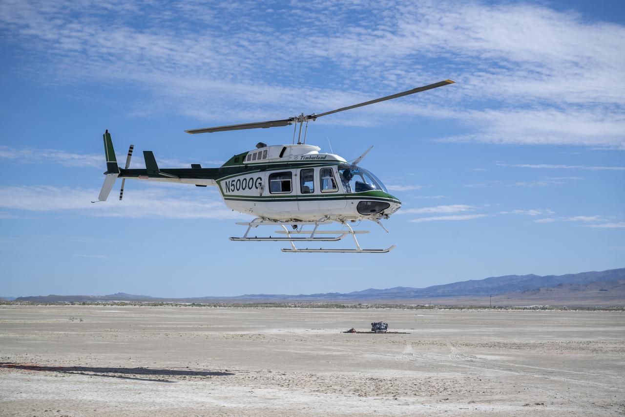 Recovery teams participate in helicopter training in preparation for the retrieval of the sample return capsule from NASA's OSIRIS-REx mission, Wednesday, July 19, 2023, at the Department of Defense's Utah Test and Training Range. The sample was collected from the asteroid Bennu in October 2020 by NASA’s OSIRIS-REx spacecraft and will return to Earth on September 24th, landing under parachute at the Utah Test and Training Range. Photo Credit: (NASA/Keegan Barber)