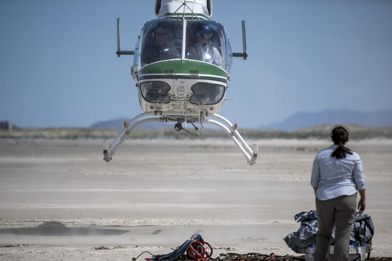 Recovery teams participate in helicopter training in preparation for the retrieval of the sample return capsule from NASA's OSIRIS-REx mission, Wednesday, July 19, 2023, at the Department of Defense's Utah Test and Training Range. The sample was collected from the asteroid Bennu in October 2020 by NASA’s OSIRIS-REx spacecraft and will return to Earth on September 24th, landing under parachute at the Utah Test and Training Range. Photo Credit: (NASA/Keegan Barber)