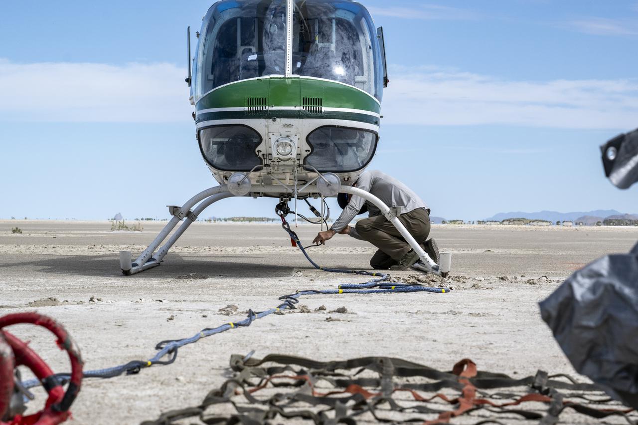 Recovery teams participate in helicopter training in preparation for the retrieval of the sample return capsule from NASA's OSIRIS-REx mission, Wednesday, July 19, 2023, at the Department of Defense's Utah Test and Training Range. The sample was collected from the asteroid Bennu in October 2020 by NASA’s OSIRIS-REx spacecraft and will return to Earth on September 24th, landing under parachute at the Utah Test and Training Range. Photo Credit: (NASA/Keegan Barber)
