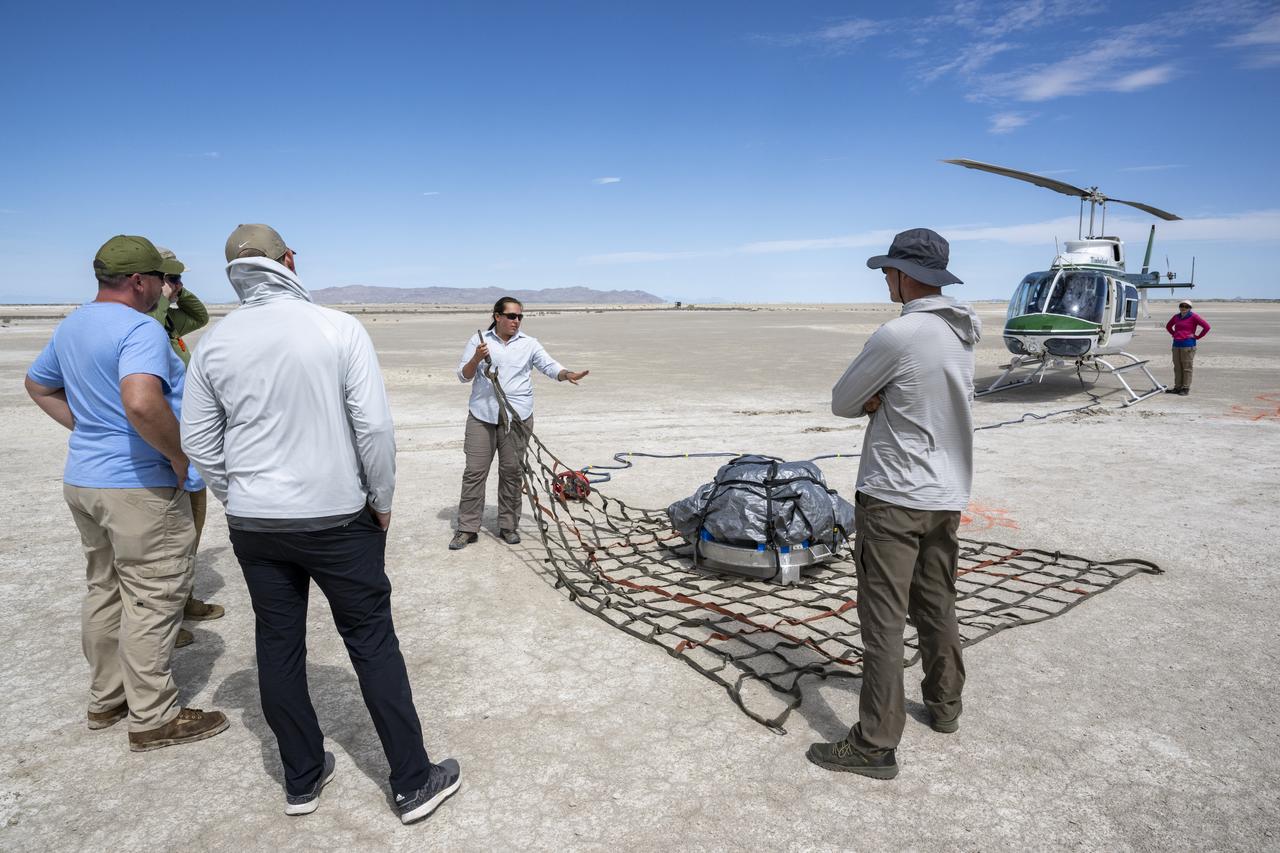 Recovery teams participate in helicopter training in preparation for the retrieval of the sample return capsule from NASA's OSIRIS-REx mission, Wednesday, July 19, 2023, at the Department of Defense's Utah Test and Training Range. The sample was collected from the asteroid Bennu in October 2020 by NASA’s OSIRIS-REx spacecraft and will return to Earth on September 24th, landing under parachute at the Utah Test and Training Range. Photo Credit: (NASA/Keegan Barber)