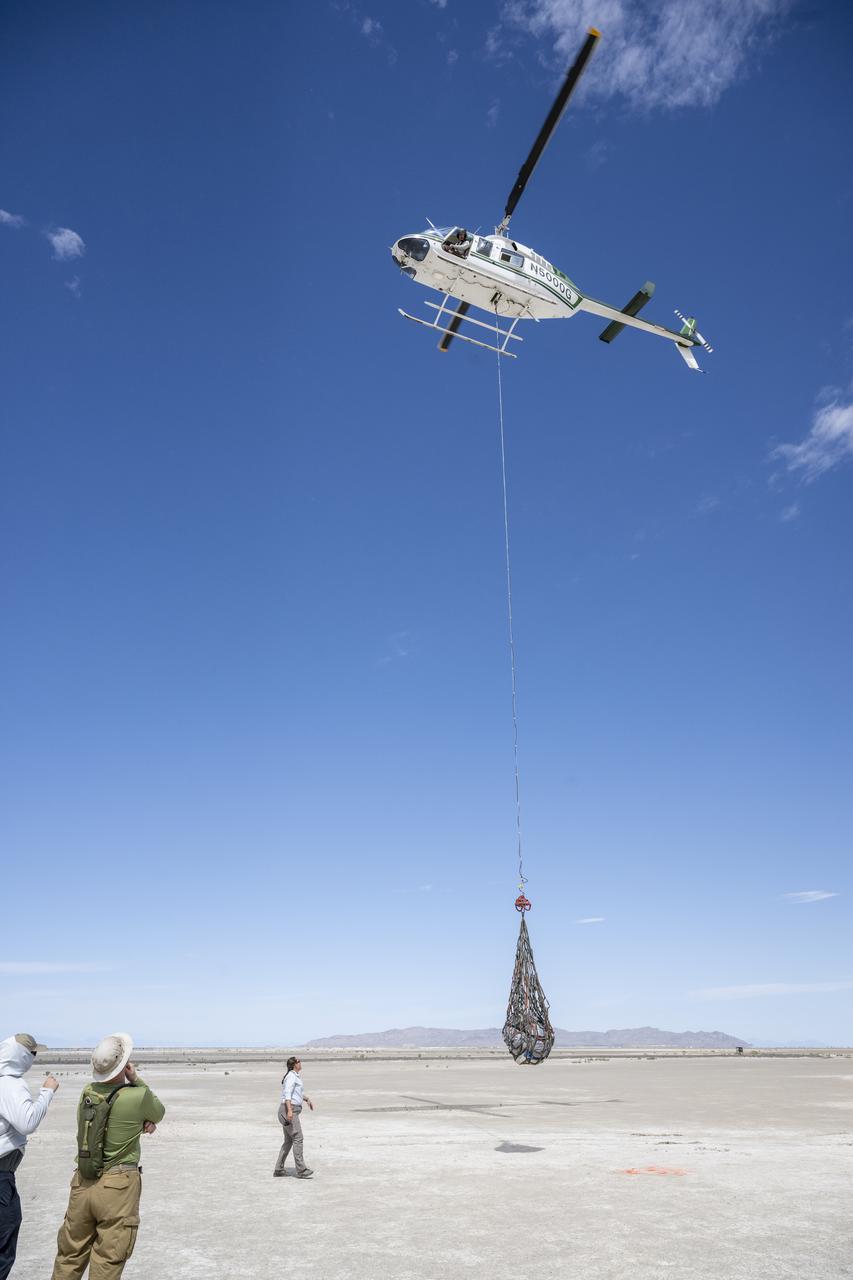 Recovery teams participate in helicopter training in preparation for the retrieval of the sample return capsule from NASA's OSIRIS-REx mission, Wednesday, July 19, 2023, at the Department of Defense's Utah Test and Training Range. The sample was collected from the asteroid Bennu in October 2020 by NASA’s OSIRIS-REx spacecraft and will return to Earth on September 24th, landing under parachute at the Utah Test and Training Range. Photo Credit: (NASA/Keegan Barber)