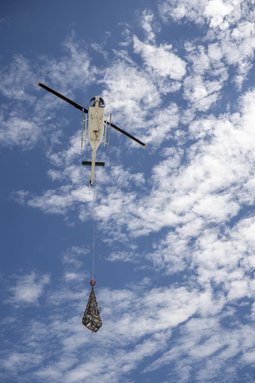 Recovery teams participate in helicopter training in preparation for the retrieval of the sample return capsule from NASA's OSIRIS-REx mission, Wednesday, July 19, 2023, at the Department of Defense's Utah Test and Training Range. The sample was collected from the asteroid Bennu in October 2020 by NASA’s OSIRIS-REx spacecraft and will return to Earth on September 24th, landing under parachute at the Utah Test and Training Range. Photo Credit: (NASA/Keegan Barber)