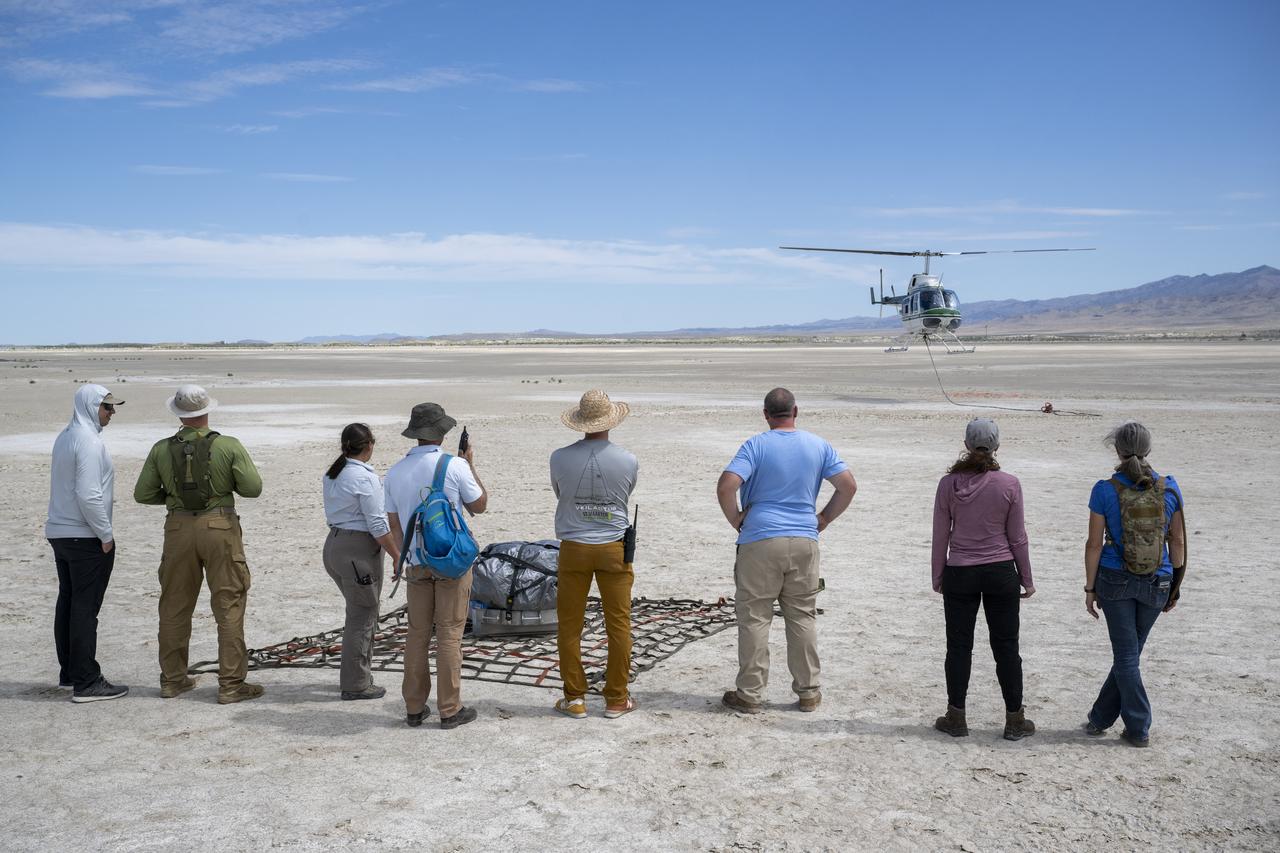 Recovery teams participate in helicopter training in preparation for the retrieval of the sample return capsule from NASA's OSIRIS-REx mission, Wednesday, July 19, 2023, at the Department of Defense's Utah Test and Training Range. The sample was collected from the asteroid Bennu in October 2020 by NASA’s OSIRIS-REx spacecraft and will return to Earth on September 24th, landing under parachute at the Utah Test and Training Range. Photo Credit: (NASA/Keegan Barber)