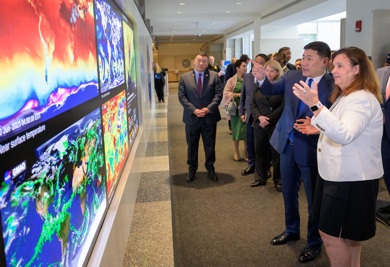 NASA Earth Science Division Director Karen St. Germain, far right, talks with Prime Minister Oyun-Erdene Luvsannamsrai of Mongolia, as they along with NASA Deputy Administrator Pam Melroy tour NASA’s Earth Information Center, Friday, Aug. 4, 2023, at the NASA Headquarters Mary W. Jackson Building in Washington. The Earth Information Center is a new immersive experience that combines live data sets with cutting-edge data visualization to show NASA data can improve lives in the face of disasters, environmental challenges, and our changing world. Photo Credit: (NASA/Bill Ingalls)