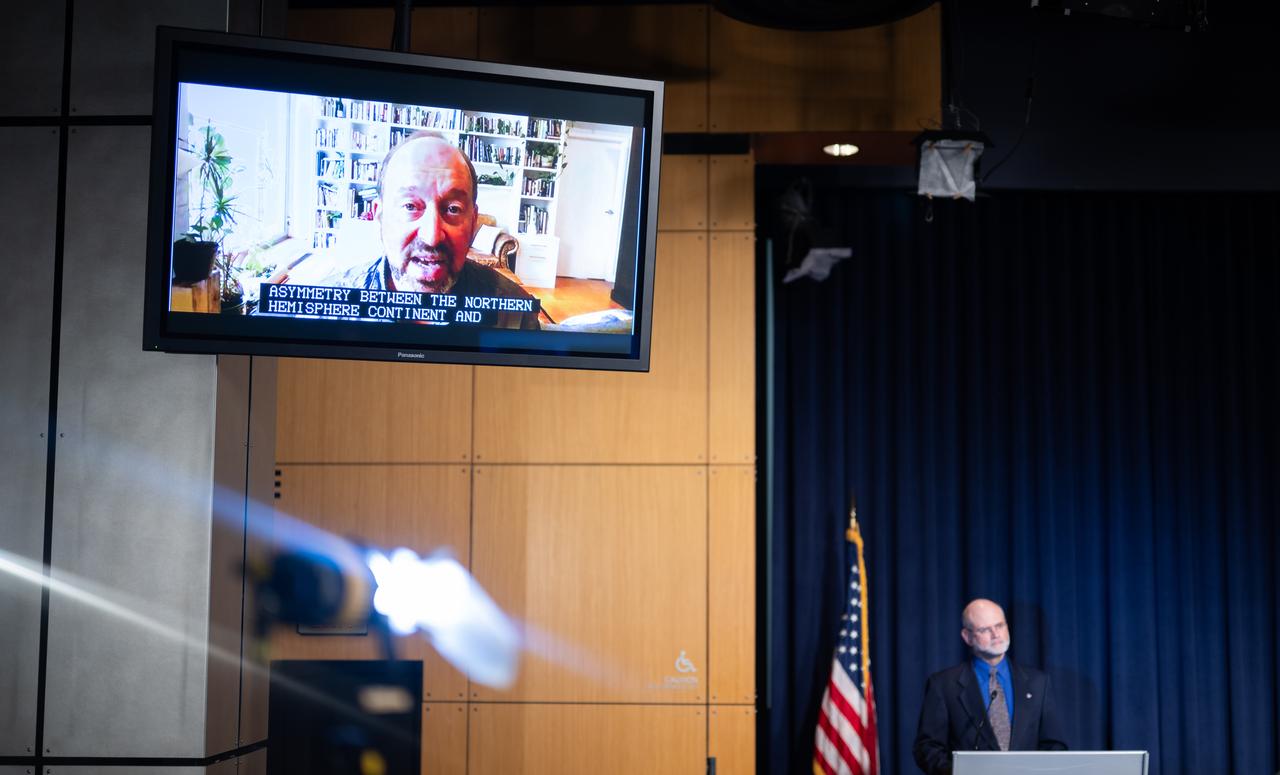 Gavin Schmidt, director of NASA’s Goddard Institute for Space Studies in New York, is seen on a monitor as he speaks during a news conference to discuss the latest global temperature data, Monday, Aug. 14, 2023, at the Mary W. Jackson NASA Headquarters building in Washington. Photo Credit: (NASA/Joel Kowsky)
