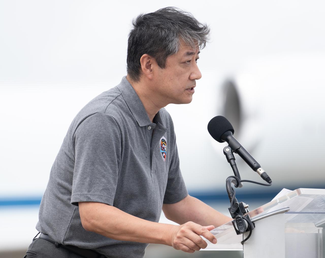 Junichi Sakai, manager of the International Space Station Program for the Japan Aerospace Exploration Agency (JAXA), delivers remarks after the arrival of NASA astronaut Jasmin Moghbeli, ESA (European Space Agency) astronaut Andreas Mogensen, Japan Aerospace Exploration Agency (JAXA) astronaut Satoshi Furukawa, and Roscosmos cosmonaut Konstantin Borisov, at the Launch and Landing Facility at NASA’s Kennedy Space Center ahead of the agency’s SpaceX Crew-7 mission, Sunday, Aug. 20, 2023, in Florida. NASA’s SpaceX Crew-7 mission is the seventh crew rotation mission of the SpaceX Dragon spacecraft and Falcon 9 rocket to the International Space Station as part of the agency’s Commercial Crew Program. Moghbeli, Mogensen, Furukawa, and Borisov are scheduled to launch at 3:49 a.m. EDT on August 25, from Launch Complex 39A at the Kennedy Space Center. Photo Credit: (NASA/Joel Kowsky)