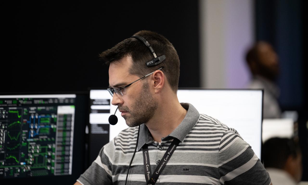 John Posey, lead engineer for Dragon in NASA’s Commercial Crew Program, monitors the countdown during a dress rehearsal in preparation for the launch of a SpaceX Falcon 9 rocket carrying the company's Dragon spacecraft on NASA’s SpaceX Crew-7 mission with NASA astronaut Jasmin Moghbeli, ESA (European Space Agency) astronaut Andreas Mogensen, Japan Aerospace Exploration Agency (JAXA) astronaut Satoshi Furukawa, and Roscosmos cosmonaut Konstantin Borisov onboard, Tuesday, Aug. 22, 2023, in SpaceX’s SpaceX’s Launch and Landing Control Center in HangerX at NASA’s Kennedy Space Center in Florida. NASA’s SpaceX Crew-7 mission is the seventh crew rotation mission of the SpaceX Dragon spacecraft and Falcon 9 rocket to the International Space Station as part of the agency’s Commercial Crew Program. Moghbeli, Mogensen, Furukawa, and Borisov are scheduled to launch on 3:49 a.m. EDT on Friday, August 25, from Launch Complex 39A at the Kennedy Space Center. Photo Credit: (NASA/Joel Kowsky)